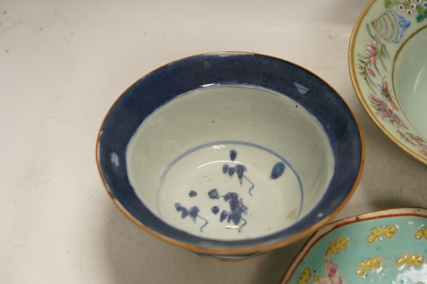 A Chinese blue and white Ming dynasty bowl, a blue and white mug and two pieces of famille rose (4), tallest 12cm. Condition - good